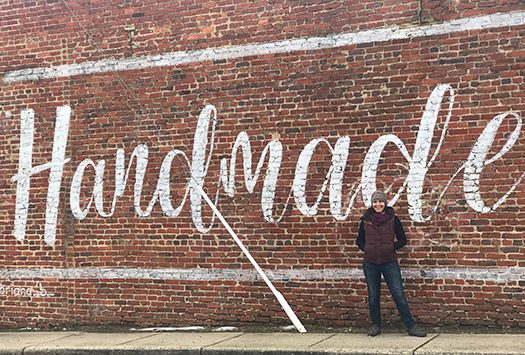 Amanda in front of "Handmade in Hyattsville" mural